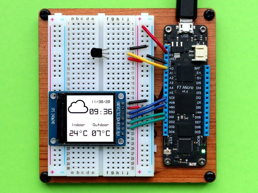 Photo showing a Meadow hooked up to an LCD displaying the date, time, indoor and outdoor temperature and a weather icon.